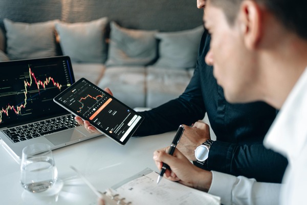Cryptocurrency trading dashboard displayed on a laptop screen
